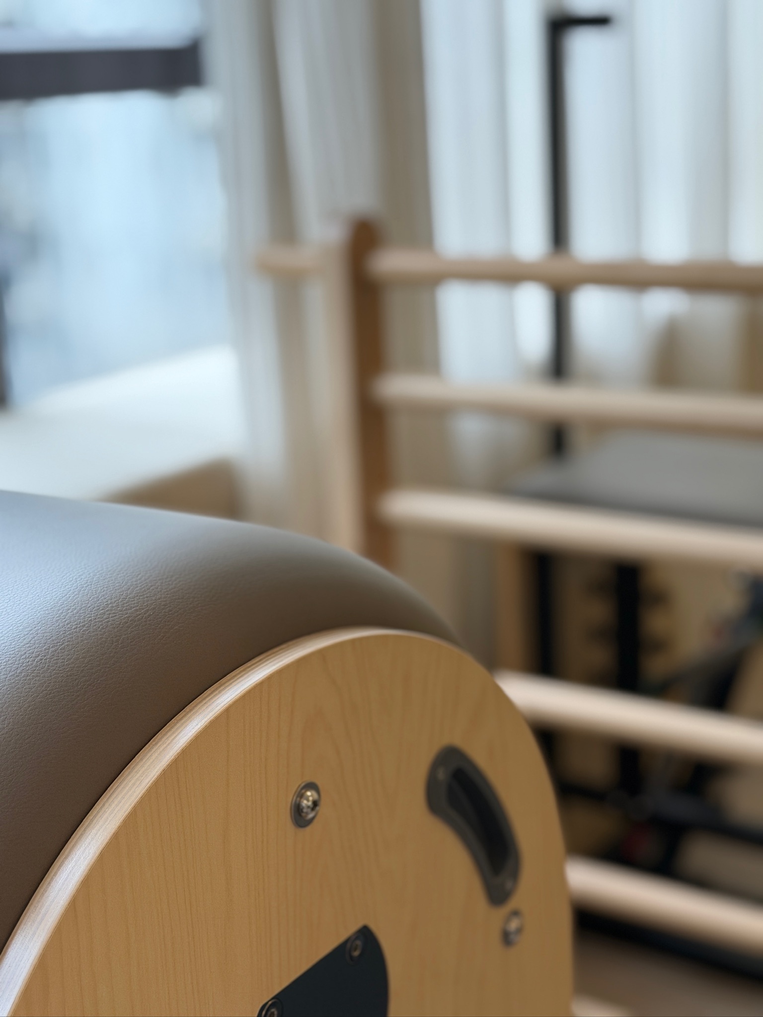 Pilates apparatus beside the OMIYOGA studio window